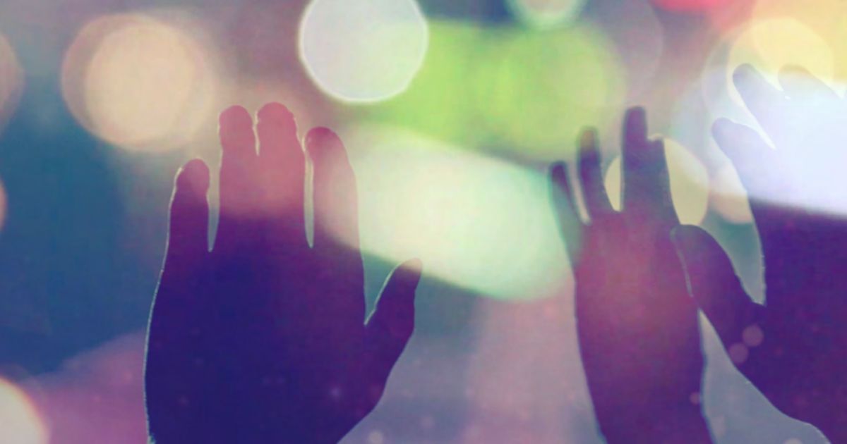 Hands in the air with soft focussed light